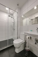 Standard Double Room | Bathroom | Shower, free toiletries, hair dryer, slippers