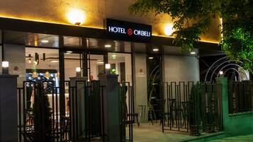 A hotel entrance with a sign reading "HOTEL ORBELI".