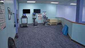 A fitness room with treadmills, stationary bikes, and a fan. - 4302  Hot tub, sauna & more resort amenities  Grandfather View @ Pinnacle (Beech Mountain)