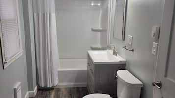 Combined shower/tub, hair dryer, towels, soap