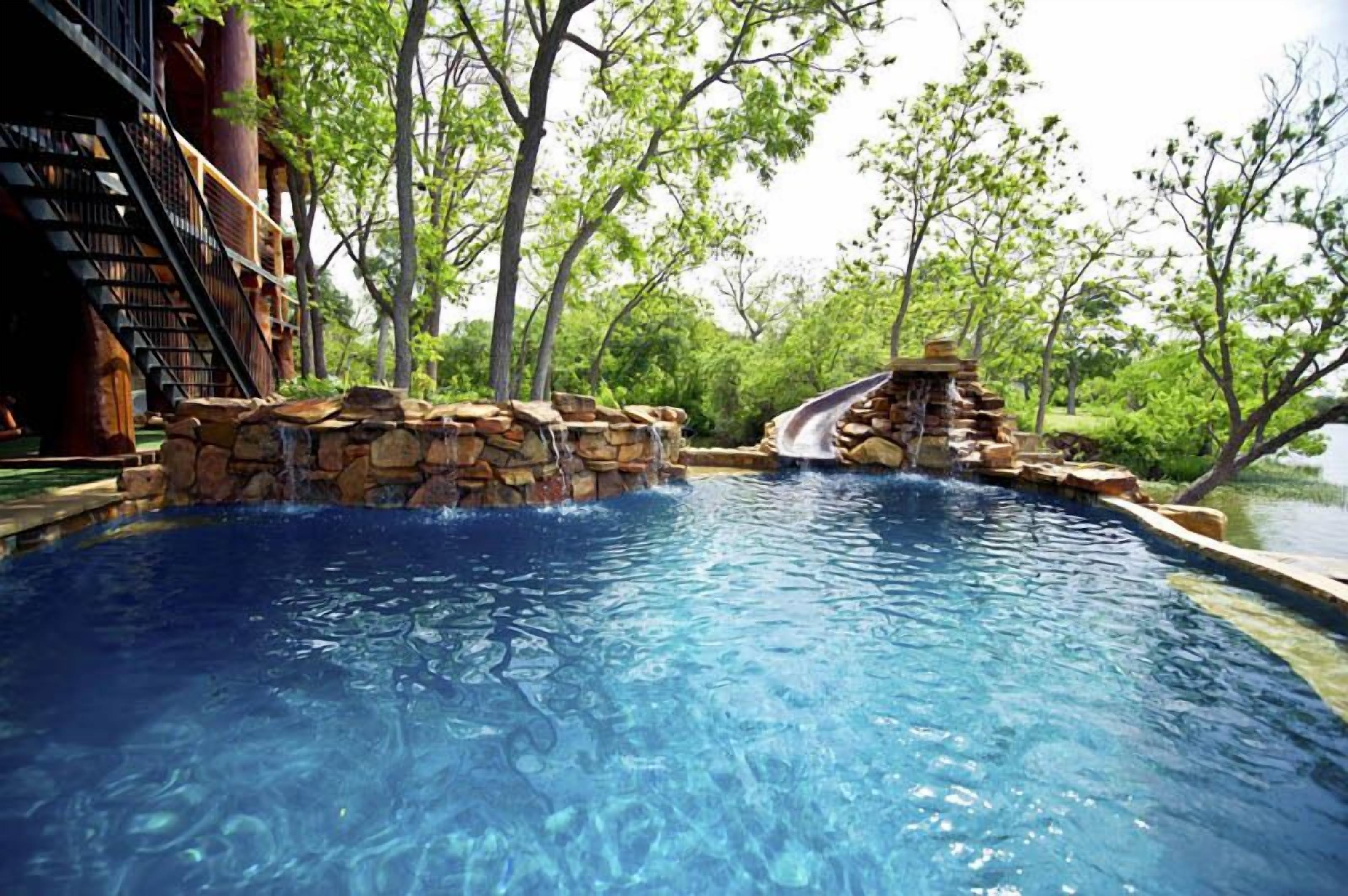 A heated pool, sun loungers