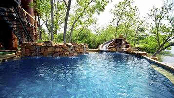 A heated pool, sun loungers