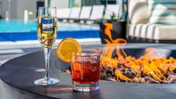 Outdoor pool, open 7:00 AM to 10:00 PM, sun loungers
