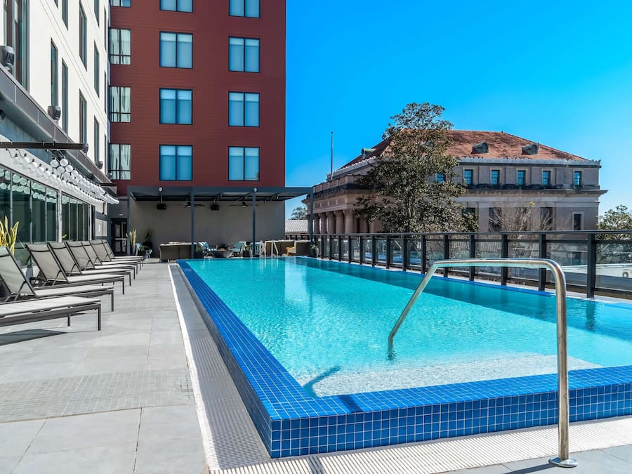 Outdoor pool, open 7:00 AM to 10:00 PM, pool loungers