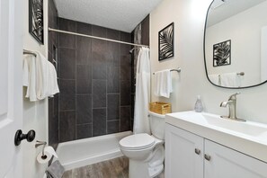 Shower, hair dryer, towels, shampoo