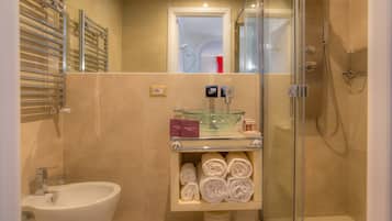 Separate bathtub and shower, rainfall showerhead, free toiletries