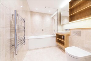 Bathtub, hair dryer, towels, soap