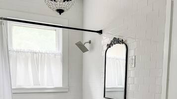 Combined shower/bathtub, hair dryer, towels, soap