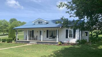 Guests can enjoy a front porch with comfortable seating.