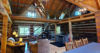 Luxury waterfront Log Cabin w/hot tub and sauna