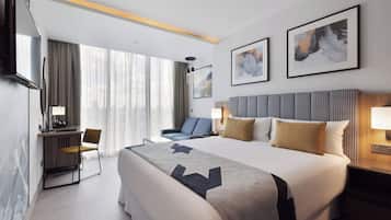 Deluxe Family Triple (1 KingBed and 1 Sofa Bed)/ (2 TwinBed |Sofa Bed) | Minibar, in-room safe, desk, laptop workspace