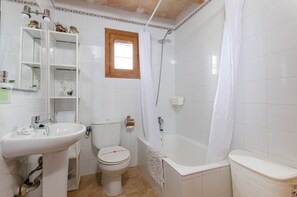 Bathtub, hair dryer, towels