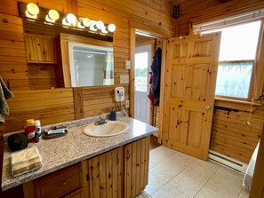 Combined shower/bathtub, hair dryer, towels, soap