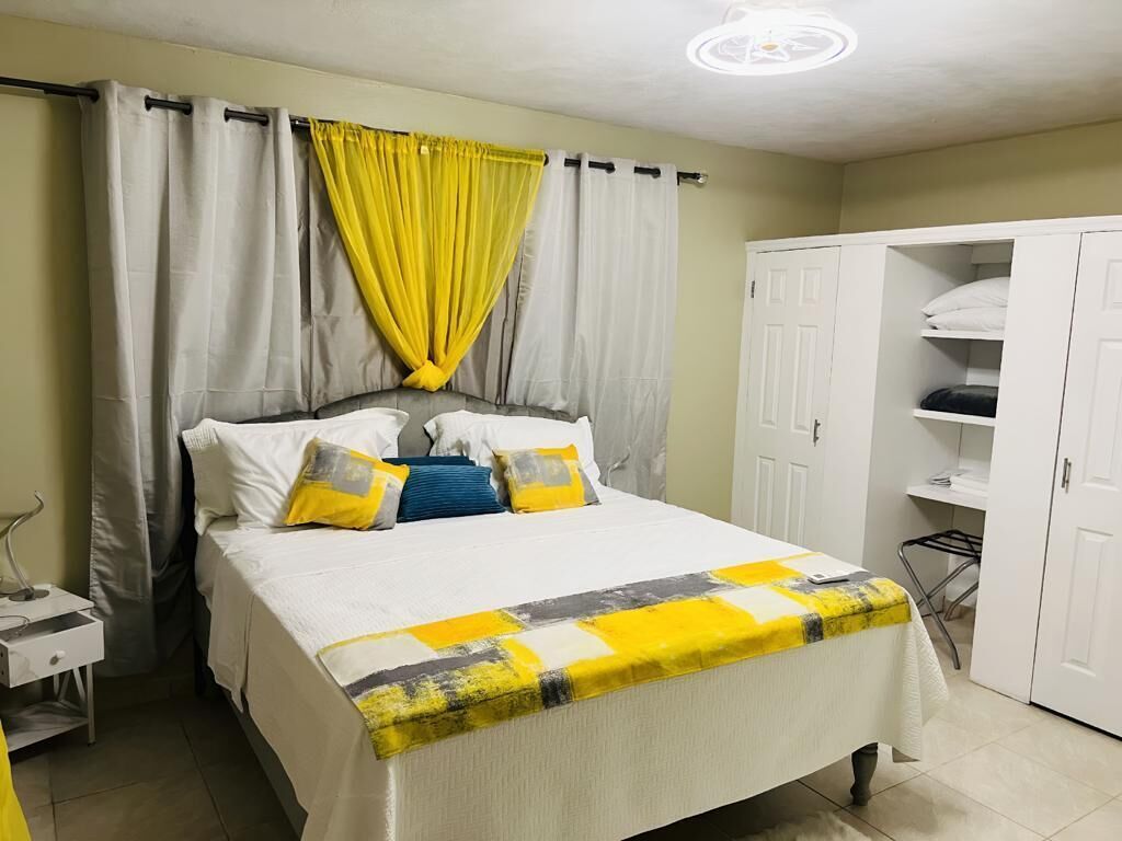 Apartamento ejecutivo | Ropa de cama de alta calidad y edredones de plumas