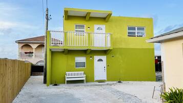 Welcome to a charming two-story residence with a welcoming entrance and a balcony offering an outdoor space.