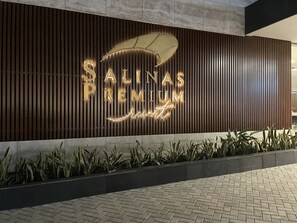 A modern building facade with a sign that reads "SALINAS PREMIUM Resort". - Salinas Premium Resort – featuring a bowling alley and a tennis court. (Salinópolis)