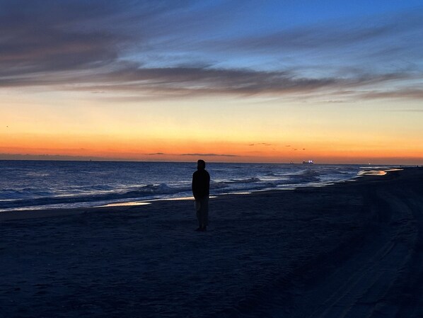 On the beach, sun loungers, beach towels