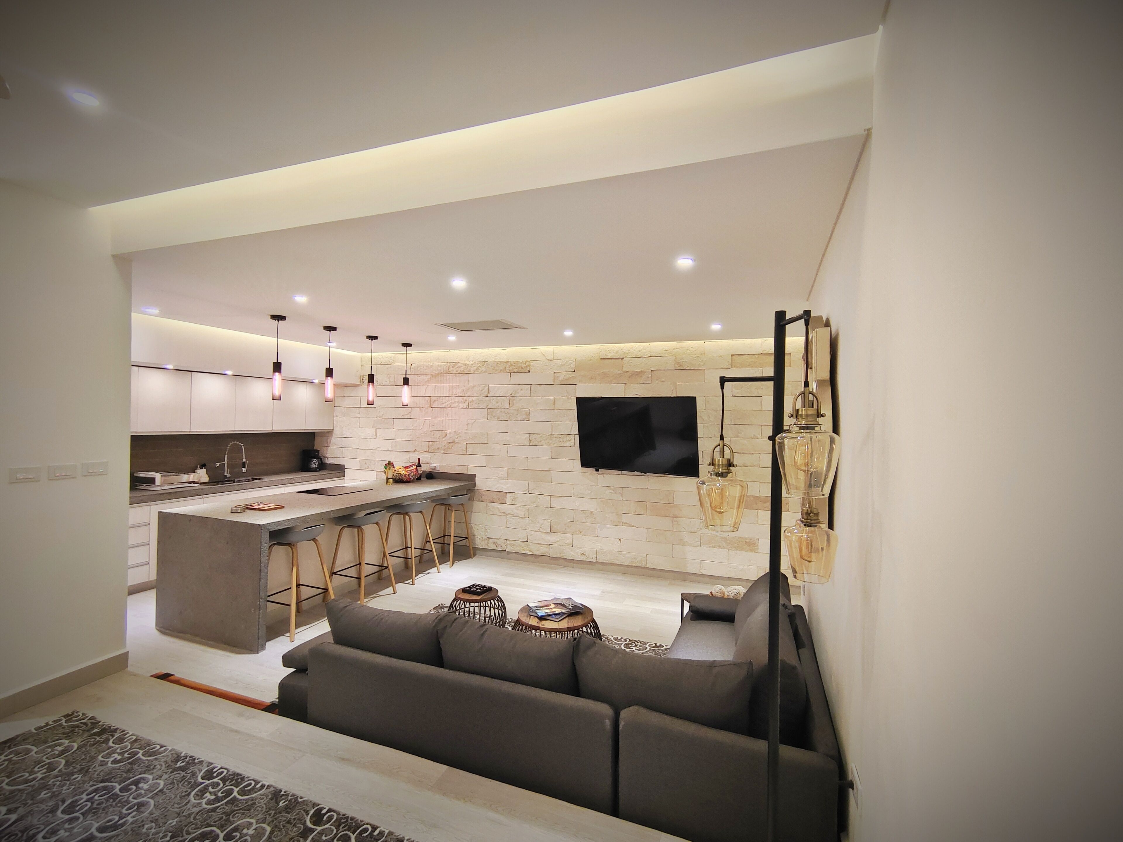 Deluxe Studio Suite | Living area | 65-inch Smart TV with digital channels, TV, Netflix