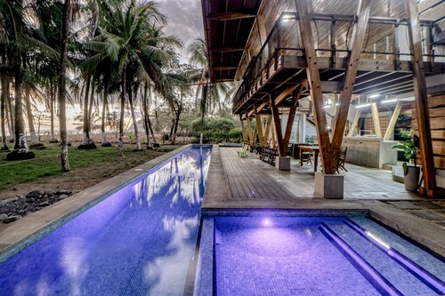 Open, dog-friendly, beachfront house with a private pool, pool spa, & WiFi
