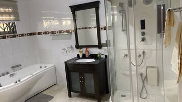 Bathtub, hair dryer, towels, soap