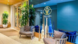 A modern interior with seating, potted plants, and a sign for 'ALLAVI LUXURY SPA'. - Wyndham Clearwater Beach Resort - 4 Bedroom (Clearwater Beach)