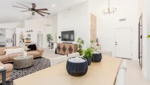 A modern living room with a sofa, coffee table, and decorative vases.