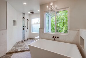 Bathtub, hair dryer, towels, soap