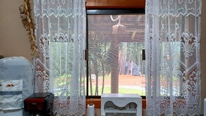 A kitchen with a coffee maker, a water dispenser, and a paper towel holder. - Sopro da Serra (Gonçalves)