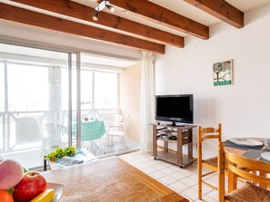 Enjoy a meal at the dining table, then step out onto the balcony for a view.