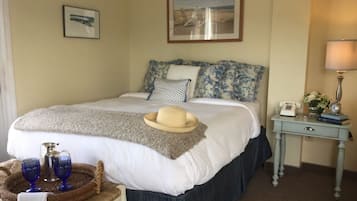 Tabla de planchar con plancha, wifi gratis y ropa de cama