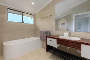 Bathtub, hair dryer, towels, soap