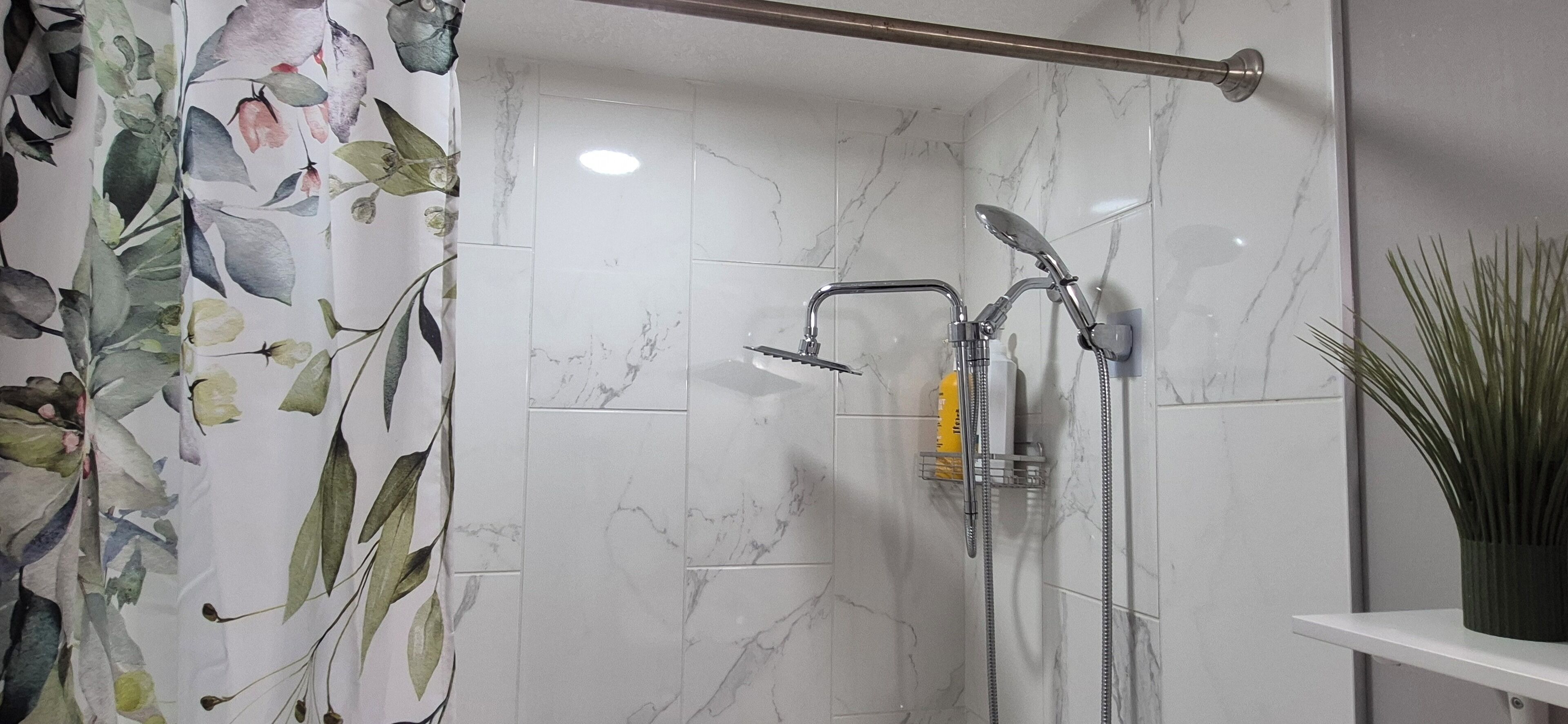 Combined shower/tub, hair dryer, towels, soap