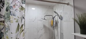 Combined shower/tub, hair dryer, towels, soap