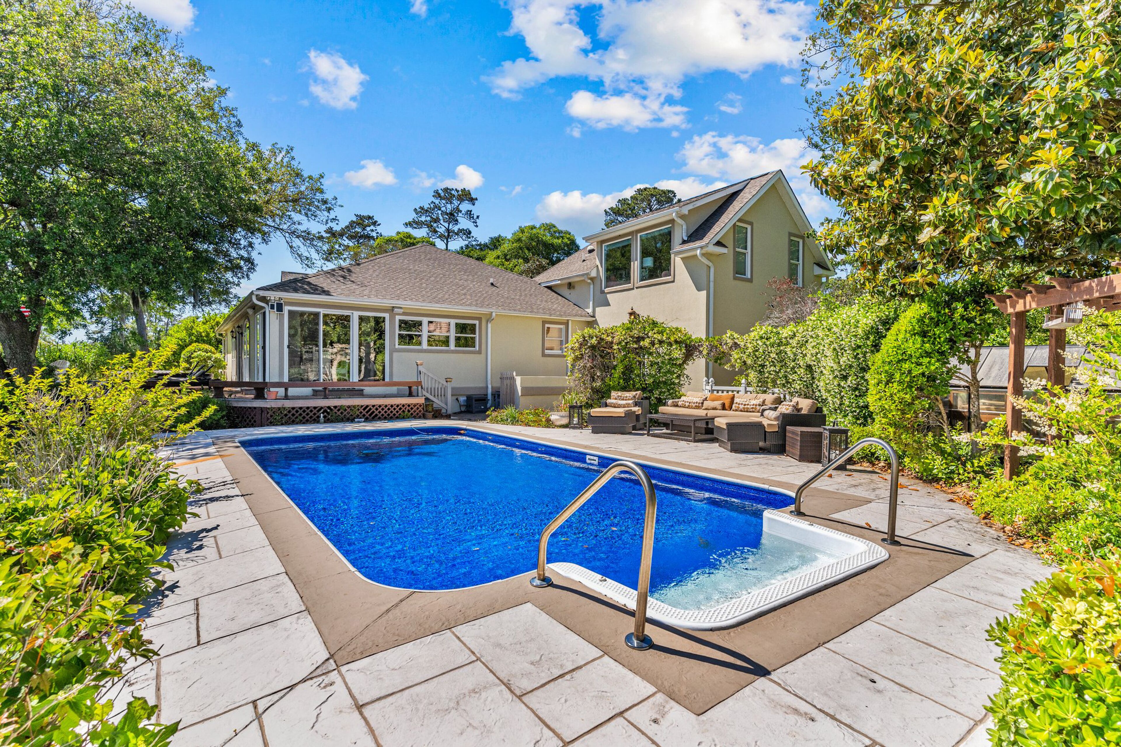 Gorgeous waterfront home with private hot tub, pool, views, deck, & fireplace