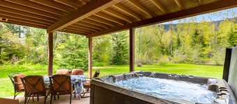 Dog-friendly riverfront home with hot tub, large yard, fast WiFi and fireplace