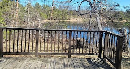 Secluded chalet in the woods overlooking a huge pond only 5 minutes to town.
