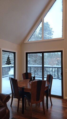 Secluded chalet in the woods overlooking a huge pond and only 5 minutes to town.