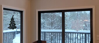 Secluded chalet in the woods overlooking a huge pond and only 5 minutes to town.