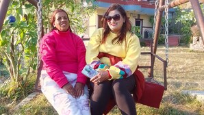 Two people sitting on a swing under a shelter. - Beautiful Lakeview rooms just 10 min by taxi from mainroad (Pokhara)