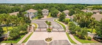 Dog-friendly ground-floor home in gated community w/lake views & enclosed patio