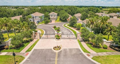 Dog-friendly ground-floor home in gated community w/lake views & enclosed patio