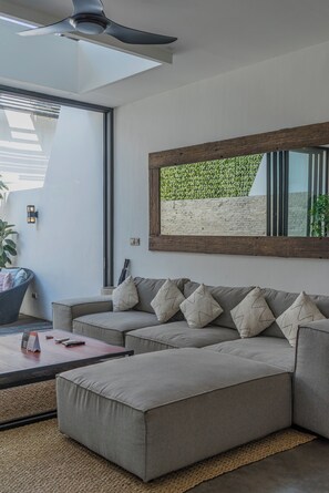 Deluxe Single Room | Living area | 42-inch LCD TV with cable channels, TV - Loft Charly (Canggu)