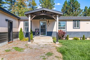 Exterior detail - Riverfront ranch with large deck, fire pit, dock, W/D, & mountain view (Sagle)