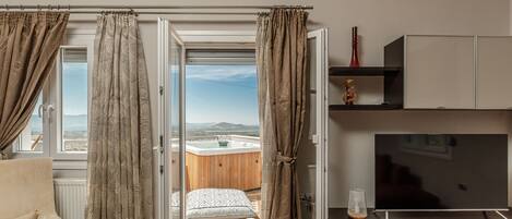 LĂ€genhet Superior | Vardagsrum | Platt-tv och eldstad