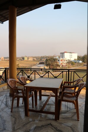 Outdoor dining - Deluxe King size bed Room with Mountain view (Chitwan)