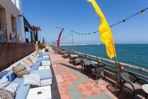 Relax on the ocean-view deck with comfortable seating and stunning sea views.