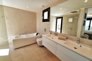Bathtub, hair dryer, towels