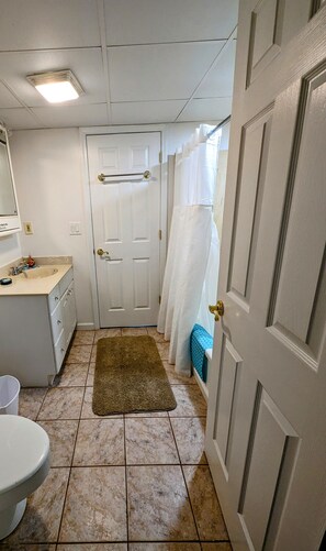 Combined shower/tub, hair dryer, towels, soap