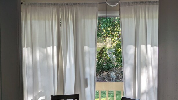 A dining area with a table, chairs, and a bowl of chips. - DAPHNE -  MOBILE BAY CONDO - Great location  (Daphne)