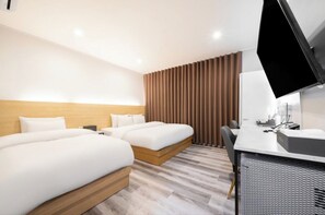 Habitación Deluxe con 2 camas individuales | Ropa de cama de alta calidad y edredones de plumas